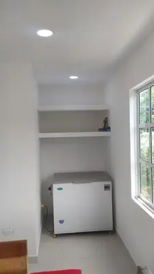 a room with a white refrigerator in a room with a window at Casa Campestre Rancho 75 Eco Park in Arjona
