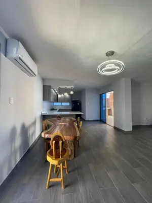 a living room with a wooden table and chairs at Villa Matthew - Villa de Lujo con Piscina Privada y BBQ, Cerca al Mar in Juan de Acosta