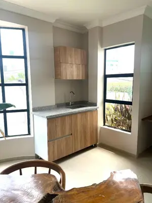 a kitchen with a sink and two windows at Apartamento cerca a Getsemaní in Cartagena de Indias