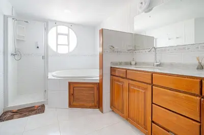 a bathroom with a sink and a shower and a tub at Luxury House Perfect Location in Cartagena de Indias