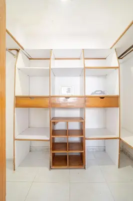 a room with white walls and wooden shelves at Luxury House Perfect Location in Cartagena de Indias