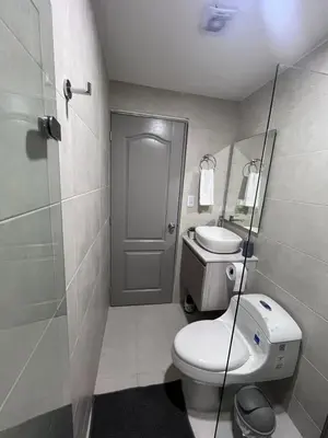 a small bathroom with a toilet and a sink at Loft Deluxe - Nuevo, Acogedor, Integral, Ubicación inmejorable in Barranquilla