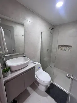 a bathroom with a sink and a toilet and a shower at Loft Deluxe - Nuevo, Acogedor, Integral, Ubicación inmejorable in Barranquilla