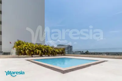 a swimming pool on the roof of a building at Beachfront Studio with Stunning Ocean Views in Cartagena de Indias