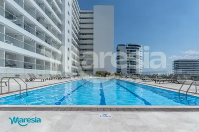an image of a swimming pool in a building at Beachfront Studio with Stunning Ocean Views in Cartagena de Indias