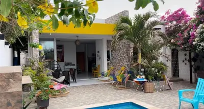 a house with a pool and some plants at Cabaña Julianita in Santa Veronica