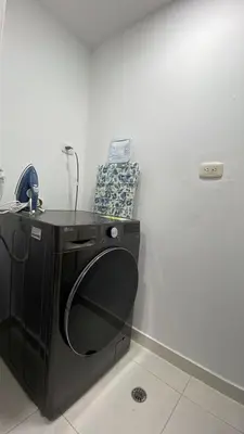 a black washer and dryer in a room at Cozy & Nice Cartagena apartment near to the beach in Cartagena de Indias