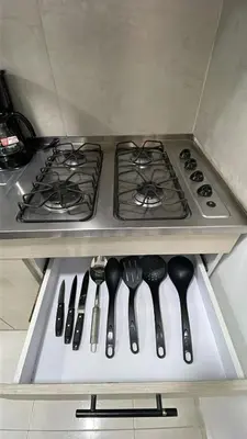 a stove top in a kitchen with utensils at Cozy & Nice Cartagena apartment near to the beach in Cartagena de Indias