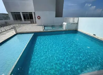 a large pool of water in front of a building at Cozy & Nice Cartagena apartment near to the beach in Cartagena de Indias