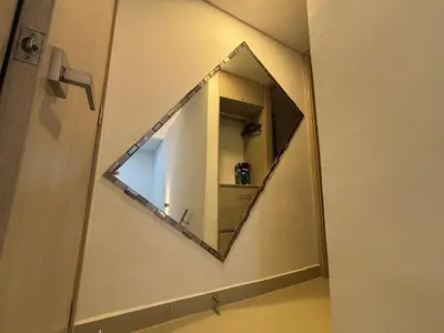 a mirror on a wall in a bathroom at Apartamento Magno Loft Bocagrande in Cartagena de Indias