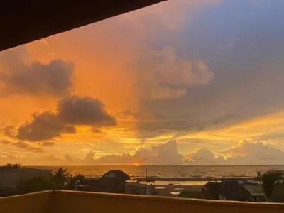 a sunset view from the balcony of a condo at Casa Española del Mar in Cartagena de Indias