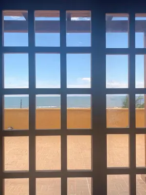 a view of the beach from a window at Casa Española del Mar in Cartagena de Indias