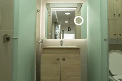 a bathroom with a sink and a mirror at Loft apartment with sea view in Cartagena de Indias