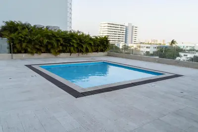 a swimming pool on the roof of a building at Loft apartment with sea view in Cartagena de Indias