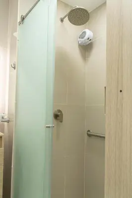 a shower with a glass door in a bathroom at Loft apartment with sea view in Cartagena de Indias