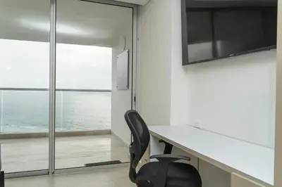 a office with a desk and a chair at Loft apartment with sea view in Cartagena de Indias