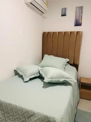a bed with two pillows on it in a room at Apartamento Marbella Piso 28 - Playa in Cartagena de Indias