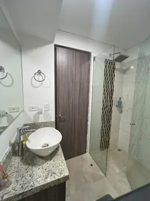 a bathroom with a sink and a shower at Serenity Flat in Puerto Tierrabaja