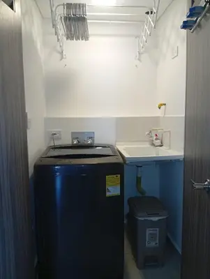 a small kitchen with a sink and a trash can at cartagena apto castelo serena del mar in Puerto Tierrabaja