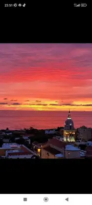 a sunset view of a city with a building at Piso apartamento Cartagena de indias in Cartagena de Indias