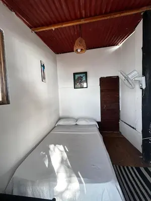 a small bedroom with a bed in a room at La playita ocean view in Playa Blanca