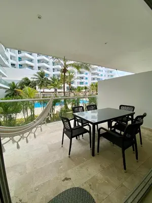a dining room with a table and chairs on a balcony at U-GO Morros epic in Cartagena de Indias