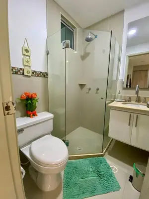 a bathroom with a toilet and a glass shower at U-GO Morros epic in Cartagena de Indias