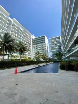 a large building with a swimming pool and a orange cone at U-GO Morros epic in Cartagena de Indias