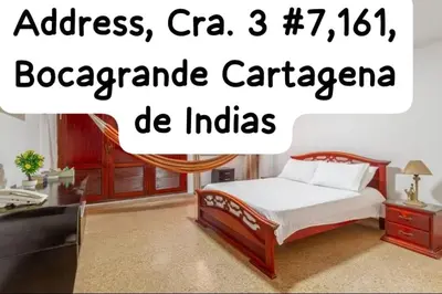 a bedroom with a bed and a desk and a television at Habitaciones cerca playa Bocagrande in Cartagena de Indias