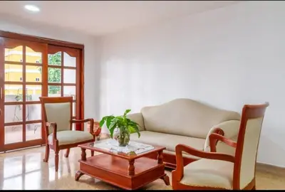 a living room with a couch and two chairs and a table at Habitaciones cerca playa Bocagrande in Cartagena de Indias