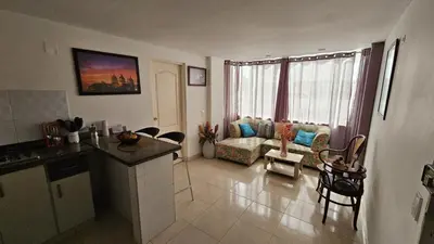 a kitchen and a living room with a couch at Turipaná 209 in Cartagena de Indias