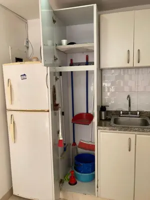 a kitchen with a sink and a white refrigerator at Turipaná 209 in Cartagena de Indias