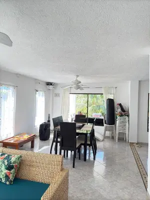a living room with a couch and a table at House Villa Las Marias in Juan de Acosta