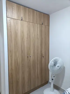 a closet with a fan next to a wooden cabinet at Torre 811 in Cartagena de Indias