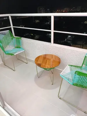 two chairs and a table on a balcony at Torre 811 in Cartagena de Indias
