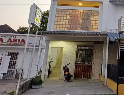 a motorcycle parked in the entrance to a building at Hotel Prado Cartagena in Cartagena de Indias