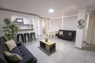 a living room with a couch and a table at Cozy apartment in bocagrande in Cartagena de Indias