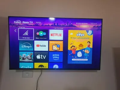 a flat screen tv hanging on a wall at Apartaestudio completo cerca Barranquilla in Galapa