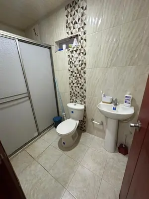 a bathroom with a toilet and a shower and a sink at Habitación en Santiago de Tolú in Santiago