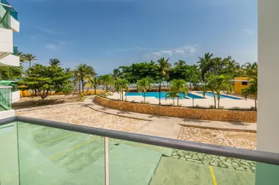 a view of the pool from the balcony of a resort at Magico Apartamento Frente al Mar 3 Habitaciones MSC22 in Coveñas