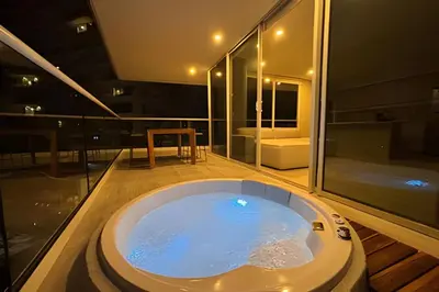 a jacuzzi tub in the middle of a house at Dominique in Cartagena de Indias