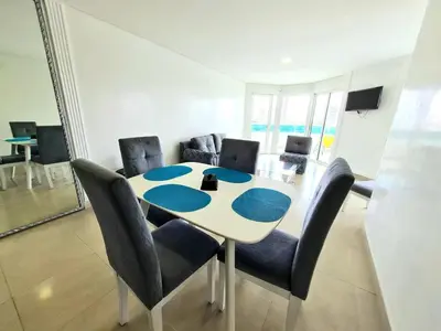 a dining room with a table and chairs at Apartamento con la mejor vista Cartagena in Cartagena de Indias