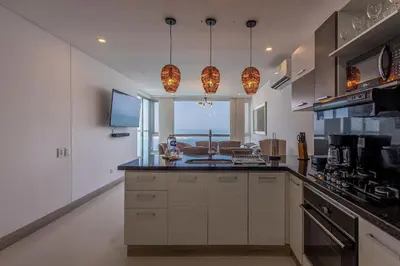 a kitchen with a counter with a sink in it at Laurhomes Laguito Floor 33, 3HBT in Cartagena de Indias
