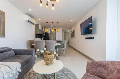 a living room with a couch and a table at Laurhomes Laguito Floor 33, 3HBT in Cartagena de Indias