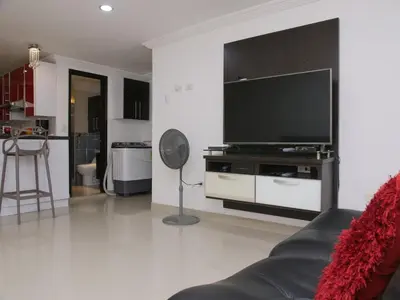 a living room with a large flat screen tv at Historic Cartagena 2BR Apt in Cartagena de Indias