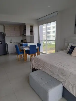 a bedroom with a bed and a table and chairs at Morros Manzanillo 324 in Cartagena de Indias