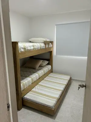 a room with a wooden shelf with mattress at Apartamento en Cartagena in Cartagena de Indias