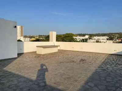 a shadow of a person standing on the roof of a building at Apartamento en Cartagena in Cartagena de Indias