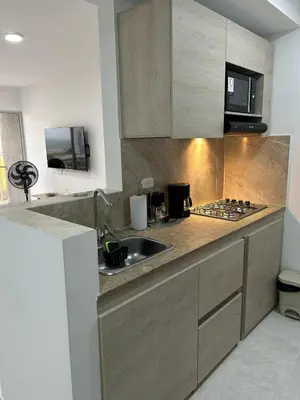 a kitchen with a sink and a microwave at Apartamento en Cartagena in Cartagena de Indias