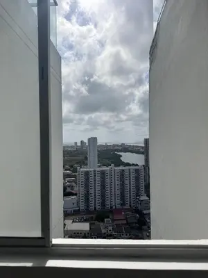 a view of a city from an open window at Hermoso apto, cerca al mar in Cartagena de Indias
